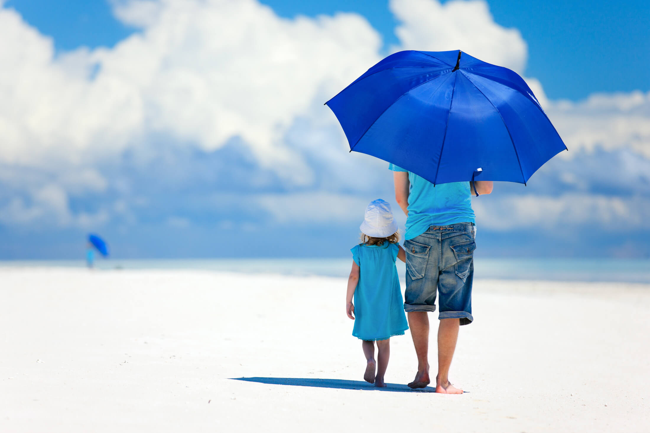 father and daughter on a beach